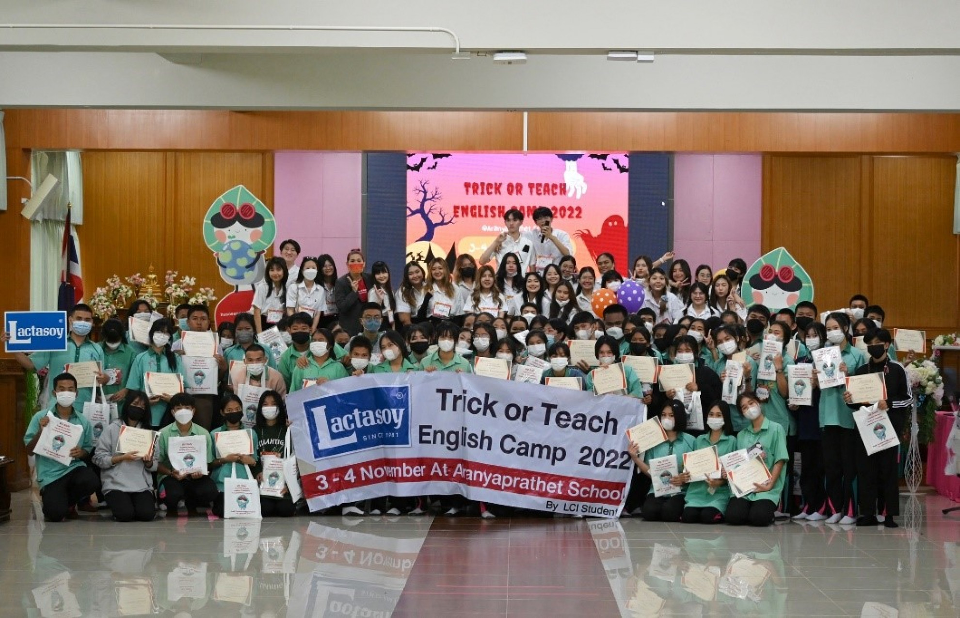 A group photo with everyone smiling, capturing the participants and organizers together.