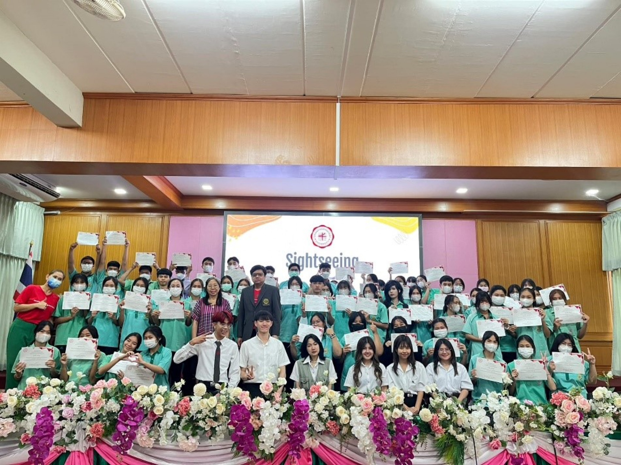 A group photo with everyone smiling, capturing the participants and organizers together.